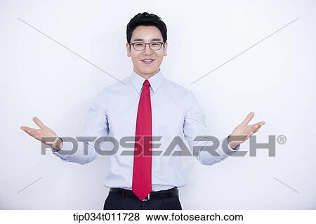 Stock Photo - a businessman using hand gesture. Fotosearch