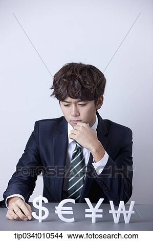 a businessman with currency blocks View Large Photo Image Picture - a businessman with currency blocks. Fotosearch
