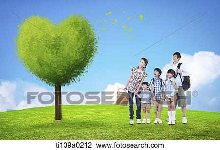 a family next to a heart shaped tree View Large Photo Image Stock Image - a family next to a heart shaped tree. Fotosearch