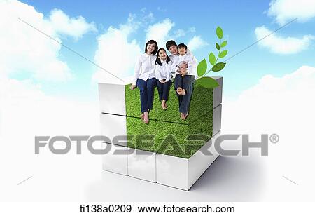 Stock Photo - a family sitting on a cube. Fotosearch