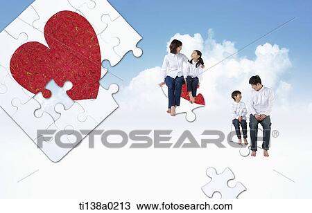 Stock Image - a family sitting on puzzle pieces. Fotosearch