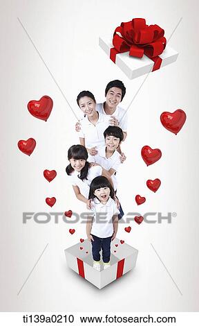 a family standing in a present box View Large Photo Image Stock Image - a family standing in a present box. Fotosearch