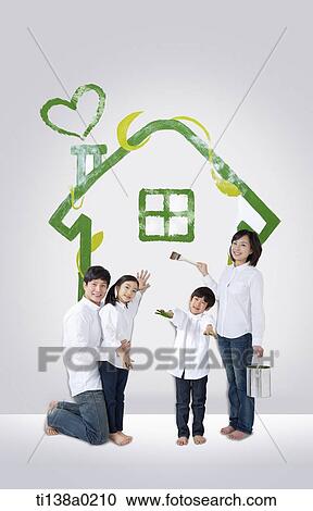 a family standing in front of a painted house View Large Photo Image Stock Image - a family standing in front of a painted house. Fotosearch
