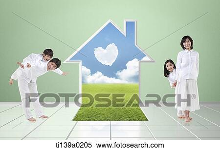 Stock Photography - a family with a house shape hole in the wall. Fotosearch