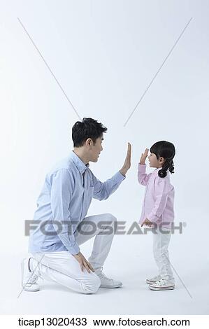 a father and a daughter doing high five View Large Photo Image Stock Image - a father and a daughter doing high five. Fotosearch