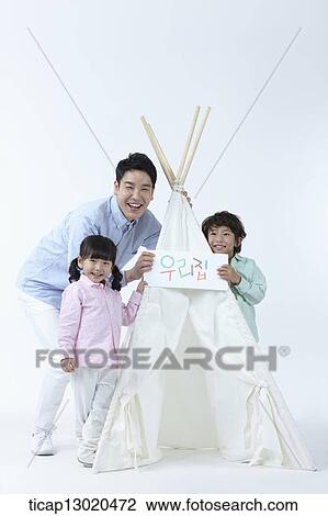 Stock Image - a father and kids playing with a tent. Fotosearch