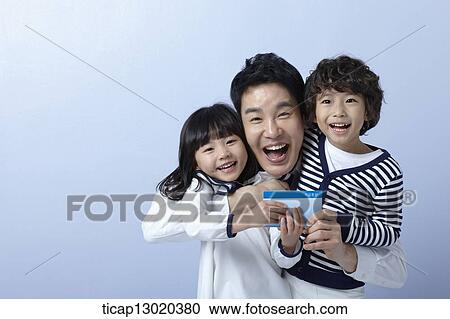 Stock Image - a father and kids with a bankbook. Fotosearch