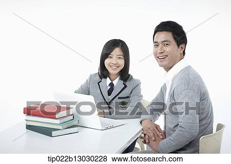 a father helping daughter with homework View Large Photo Image Stock Photo - a father helping daughter with homework. Fotosearch