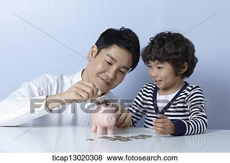Stock Photo - a father helping son to save money. Fotosearch