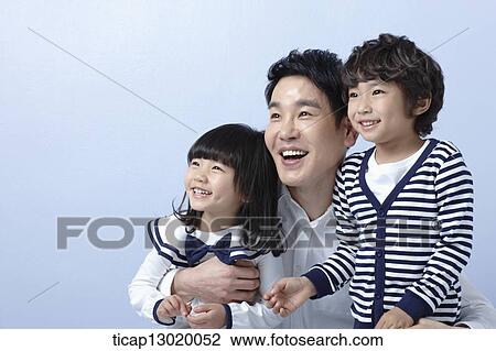 a father hugging daughter and son View Large Photo Image Stock Image - a father hugging daughter and son. Fotosearch