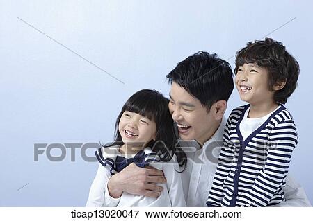 a father hugging daughter and son View Large Photo Image Stock Photo - a father hugging daughter and son. Fotosearch