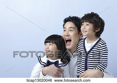 a father hugging daughter and son View Large Photo Image Stock Photograph - a father hugging daughter and son. Fotosearch