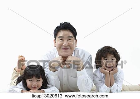 a father lying on the floor with his kids View Large Photo Image Stock Image - a father lying on the floor with his kids. Fotosearch