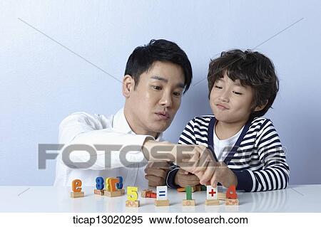 a father playing with his son View Large Photo Image Stock Photography - a father playing with his son. Fotosearch