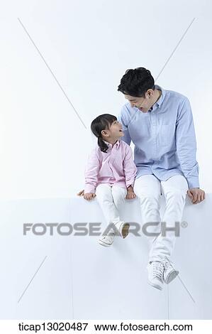 a father sitting with his daughter View Large Photo Image Stock Photo - a father sitting with his daughter. Fotosearch