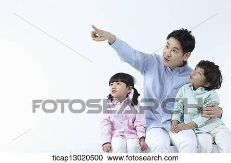 Stock Image - a father sitting with his kids. Fotosearch