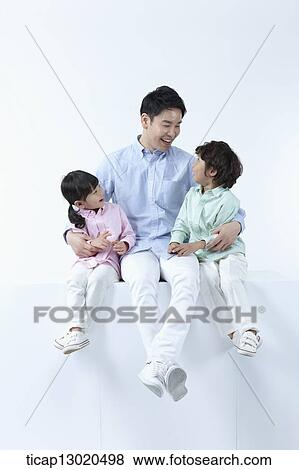 a father sitting with his kids View Large Photo Image Stock Photo - a father sitting with his kids. Fotosearch