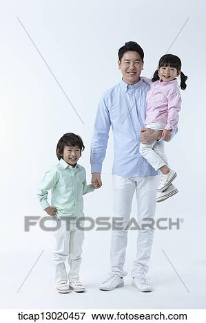Stock Photo - a father walking with kids. Fotosearch
