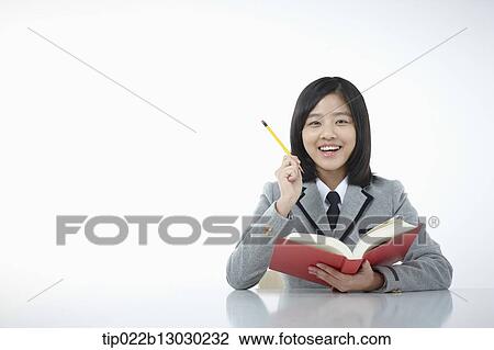 a girl doing homework View Large Photo Image Stock Image - a girl doing homework. Fotosearch