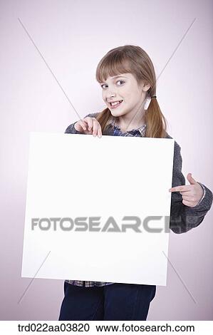 a girl holding a blank piece of paper View Large Photo Image Stock Image - a girl holding a blank piece of paper. Fotosearch