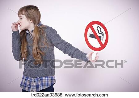a girl holding boards saying no smoking View Large Photo Image Stock Photo - a girl holding boards saying no smoking. Fotosearch