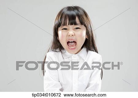 Stock Image - a girl in white shirt shouting. Fotosearch