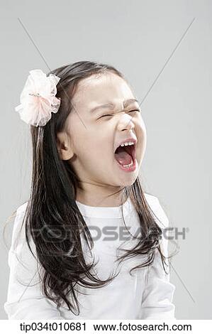 a girl in white shirt shouting View Large Photo Image Stock Image - a girl in white shirt shouting. Fotosearch