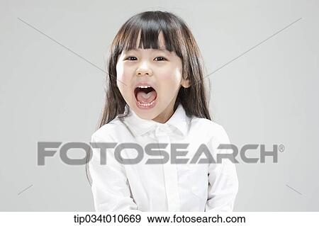 Stock Photo - a girl in white shirt shouting. Fotosearch