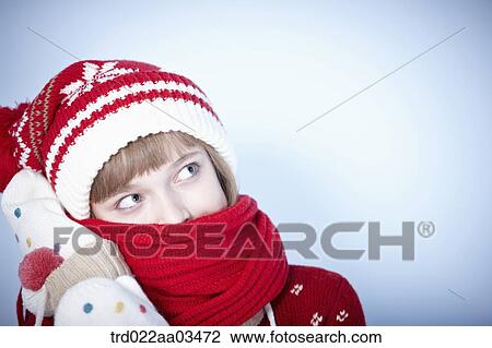a girl in winter outfit covering face with scarf View Large Photo Image Stock Image - a girl in winter outfit covering face with scarf. Fotosearch