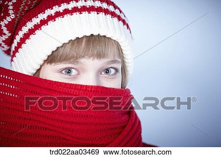 a girl in winter outfit covering face with scarf View Large Photo Image Stock Photo - a girl in winter outfit covering face with scarf. Fotosearch