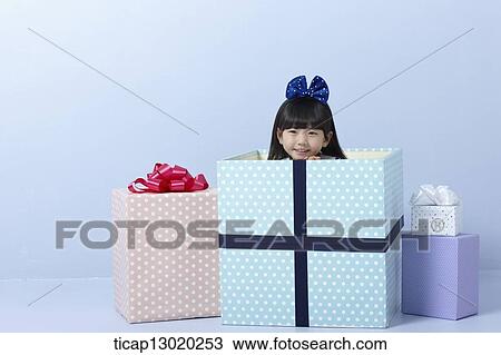 a girl inside a present View Large Photo Image Stock Image - a girl inside a present. Fotosearch