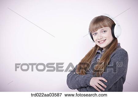 a girl listening to music with headphone View Large Photo Image Stock Photo - a girl listening to music with headphone. Fotosearch