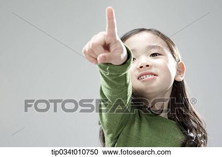 a girl pointing something View Large Photo Image Stock Image - a girl pointing something. Fotosearch