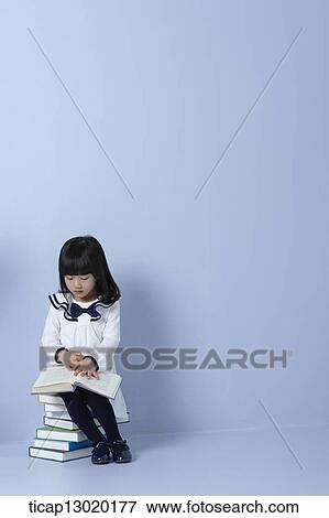 a girl reading books View Large Photo Image Stock Photo - a girl reading books. Fotosearch