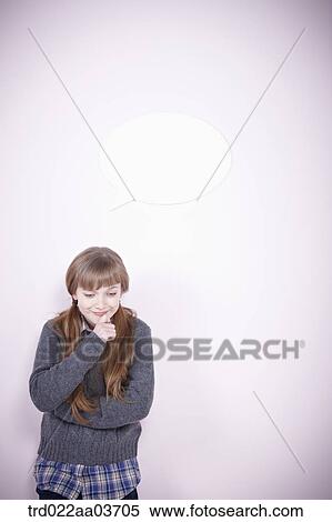 a girl smiling while standing View Large Photo Image Stock Photography - a girl smiling while standing. Fotosearch