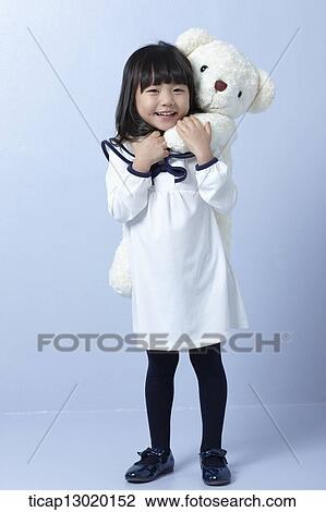 a girl with a teddy bear View Large Photo Image Stock Image - a girl with a teddy bear. Fotosearch