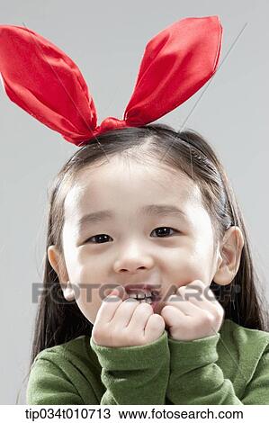 a girl with bunny hair band posing View Large Photo Image Stock Image - a girl with bunny hair band posing. Fotosearch