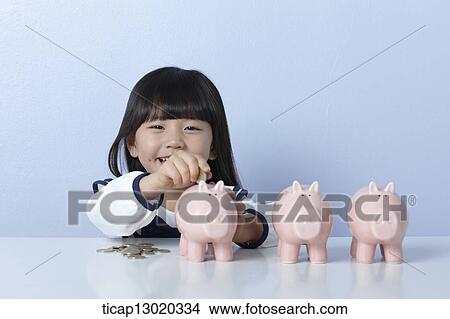 a girl with coins and piggy banks View Large Photo Image Picture - a girl with coins and piggy banks. Fotosearch