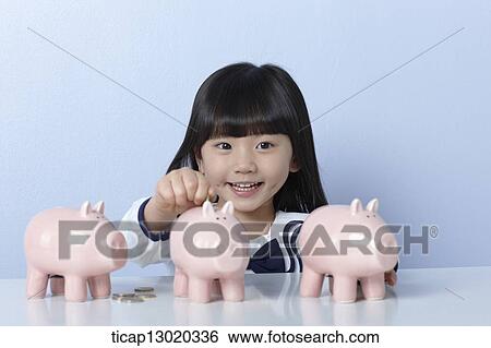 Stock Photograph - a girl with coins and piggy banks. Fotosearch