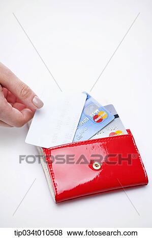 a hand taking credit cards from a wallet View Large Photo Image Stock Photo - a hand taking credit cards from a wallet. Fotosearch