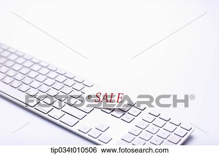 Stock Photograph - a keyboard with a memo saying sale. Fotosearch
