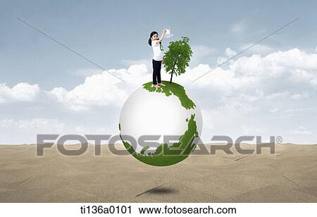 a kid planting tree on top of a globe View Large Photo Image Stock Image - a kid planting tree on top of a globe. Fotosearch