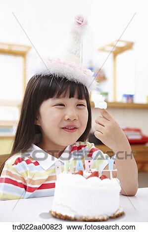 a kid playing with a birthday cake View Large Photo Image Stock Image - a kid playing with a birthday cake. Fotosearch