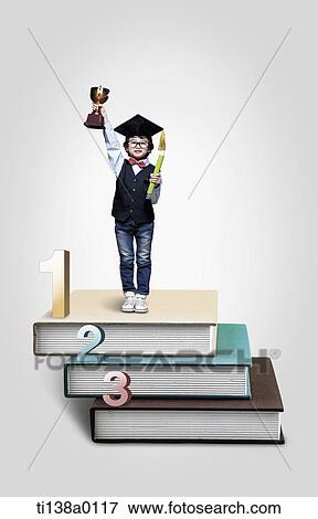 a kid standing on a pile of books with a trophy View Large Photo Image Stock Photo - a kid standing on a pile of books with a trophy. Fotosearch