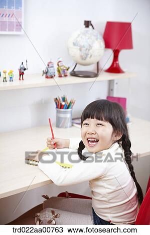 a kid studying at table View Large Photo Image Stock Image - a kid studying at table. Fotosearch
