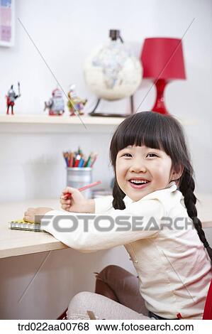 a kid studying at table View Large Photo Image Stock Photo - a kid studying at table. Fotosearch