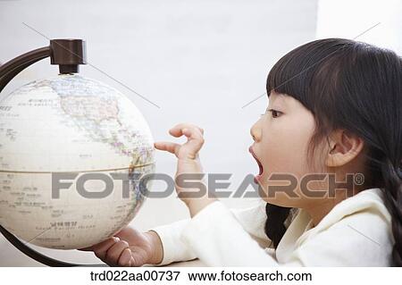 a kid studying with globe at table View Large Photo Image Stock Photo - a kid studying with globe at table. Fotosearch