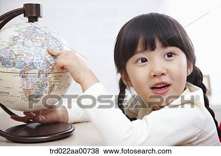 a kid studying with globe at table View Large Photo Image Stock Photo - a kid studying with globe at table. Fotosearch