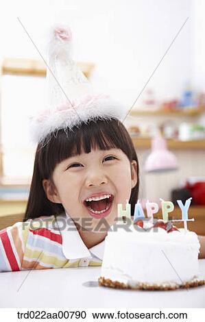 a kid with a birthday cake in front View Large Photo Image Stock Image - a kid with a birthday cake in front. Fotosearch