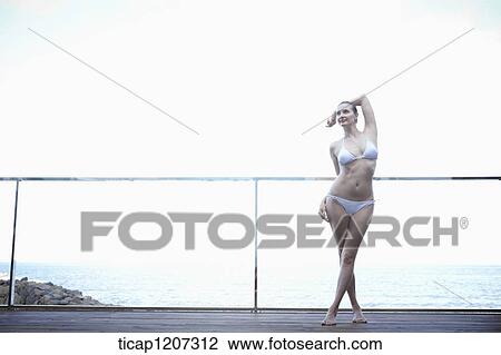 a lady in bikini posing View Large Photo Image Stock Image - a lady in bikini posing . Fotosearch